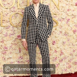 Eddie Redmayne in a checkered statement suit
